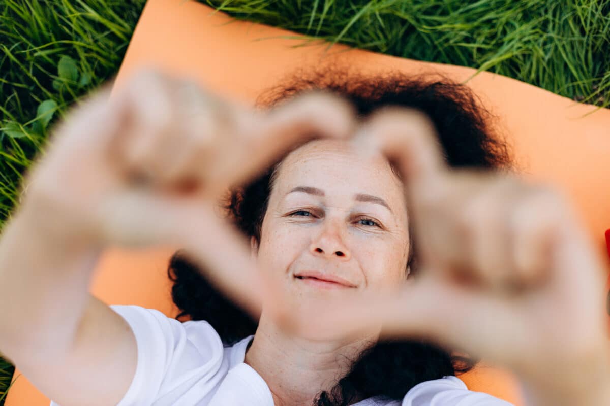 Woman heart gesture NDIS care