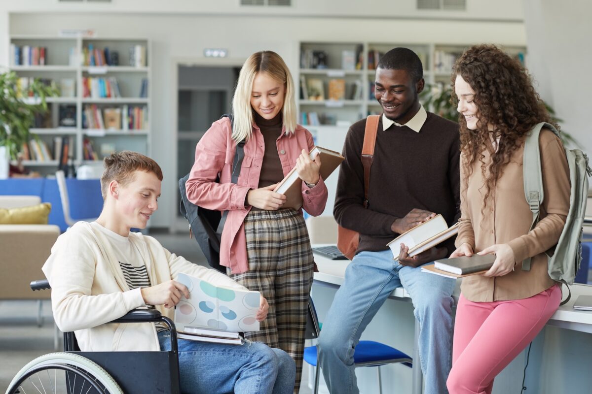 Student Using Wheelchair in Library young stroke survivor support
