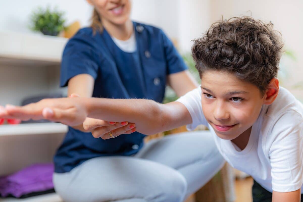 Child training with physical therapist for balance improvement Autism physiotherapy session